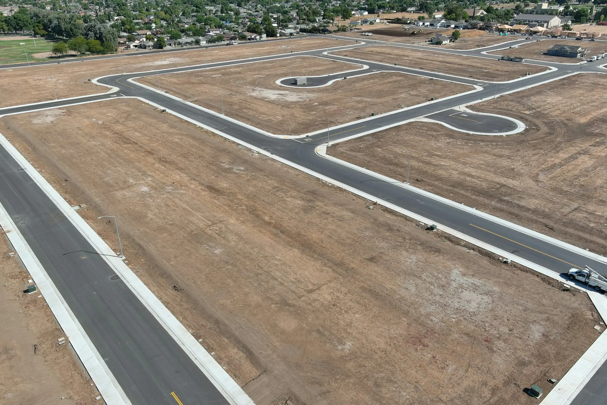 Aerial view of a new subdivision with freshly paved streets